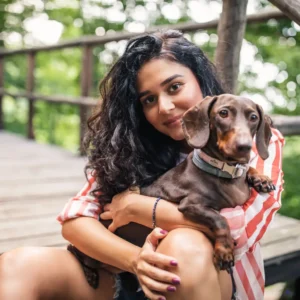 An image of our founder, Amy Roberts, with her dog.