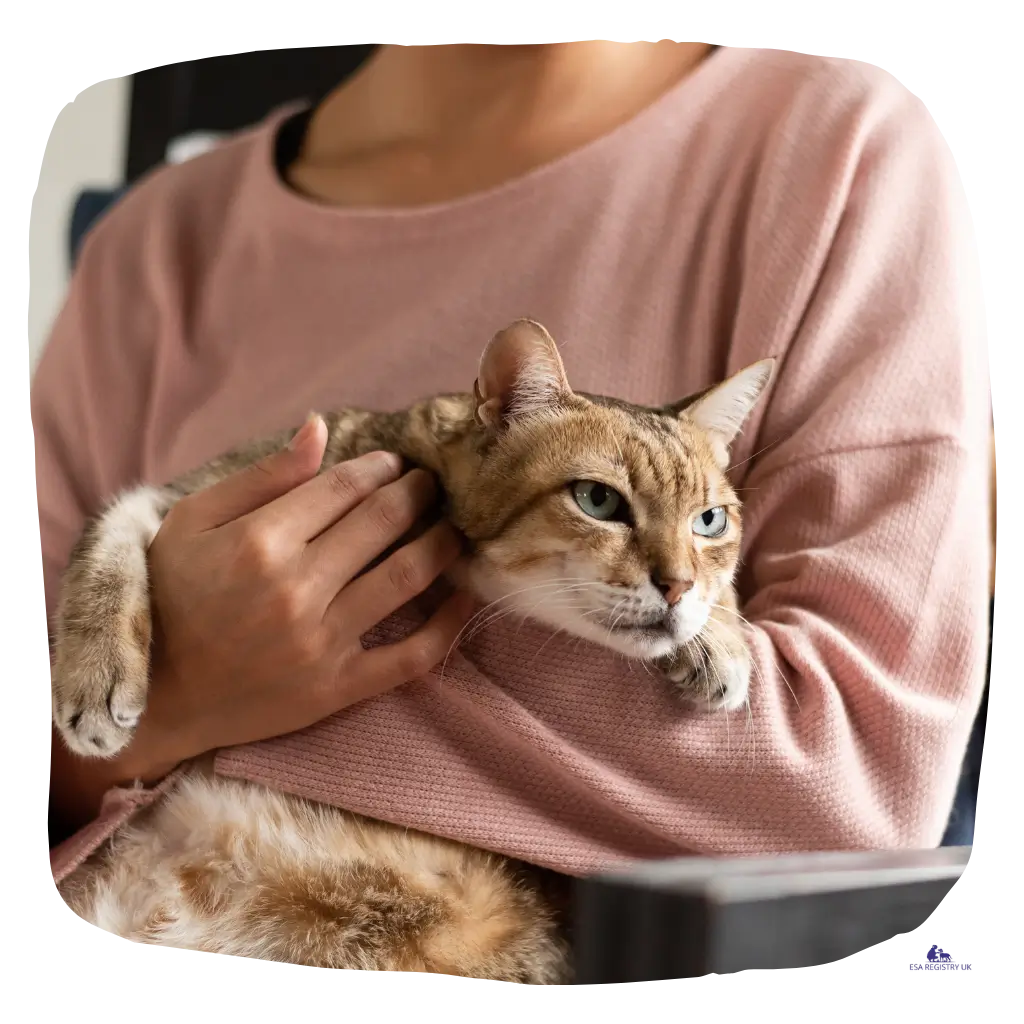 An image of a woman holding her emotional support cat in Germany.